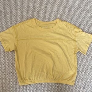 Yellow lounge life cropped tee in size M. Elastic waistband bottom of shirt.